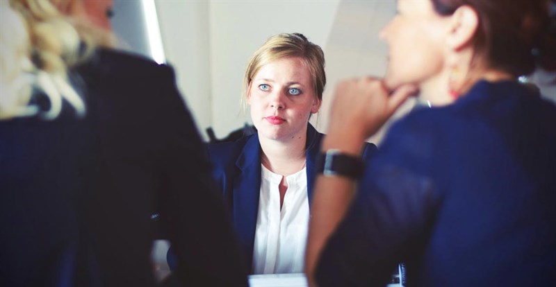 woman in suit at meeting